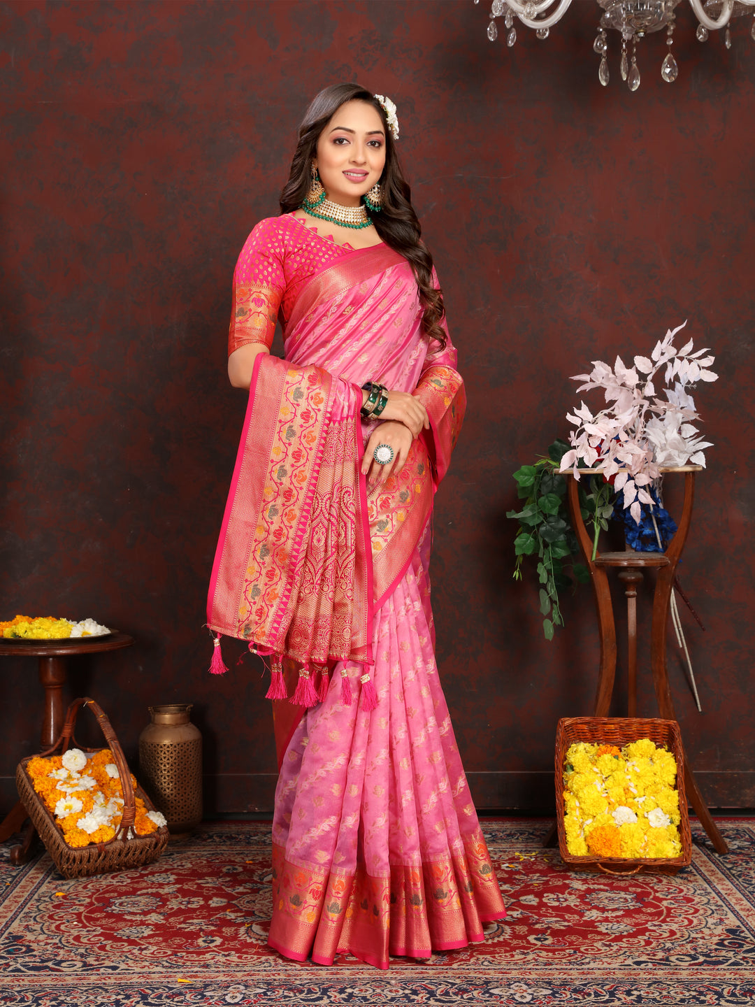 Stunning pink organza saree with graceful detailing and a matching blouse piece, ideal for festive occasions.