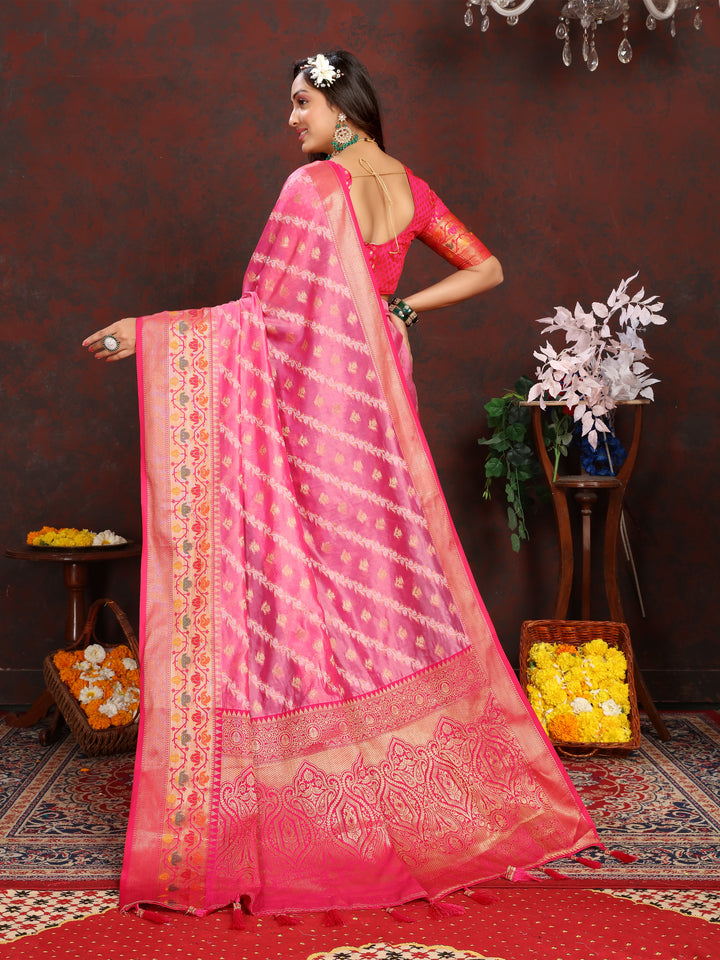 Classic pink saree in soft organza with intricate embroidery and a matching blouse piece, perfect for elegant events.