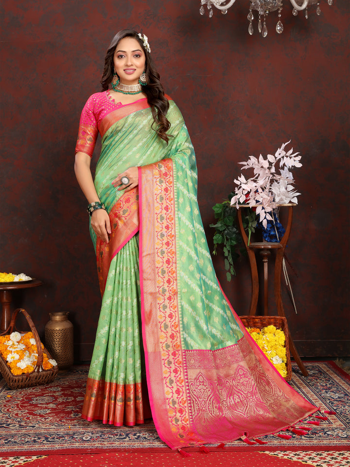 Elegant pista green soft organza saree with delicate embroidery, paired with a matching blouse piece for weddings.