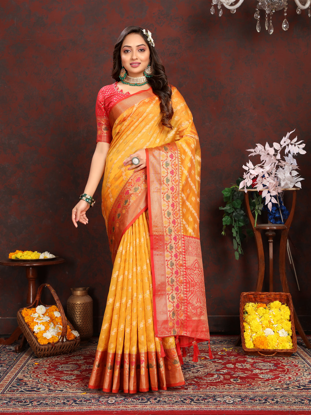 Gorgeous yellow organza saree with intricate embroidery and matching blouse piece, perfect for traditional events and weddings.