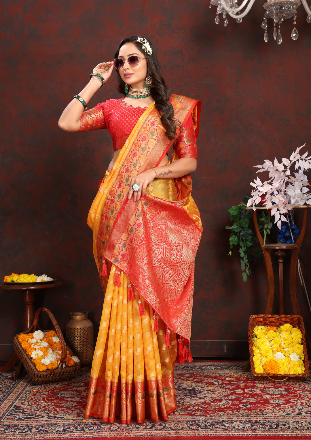 Classic yellow saree in soft organza with exquisite designs and matching blouse piece, perfect for elegant occasions.