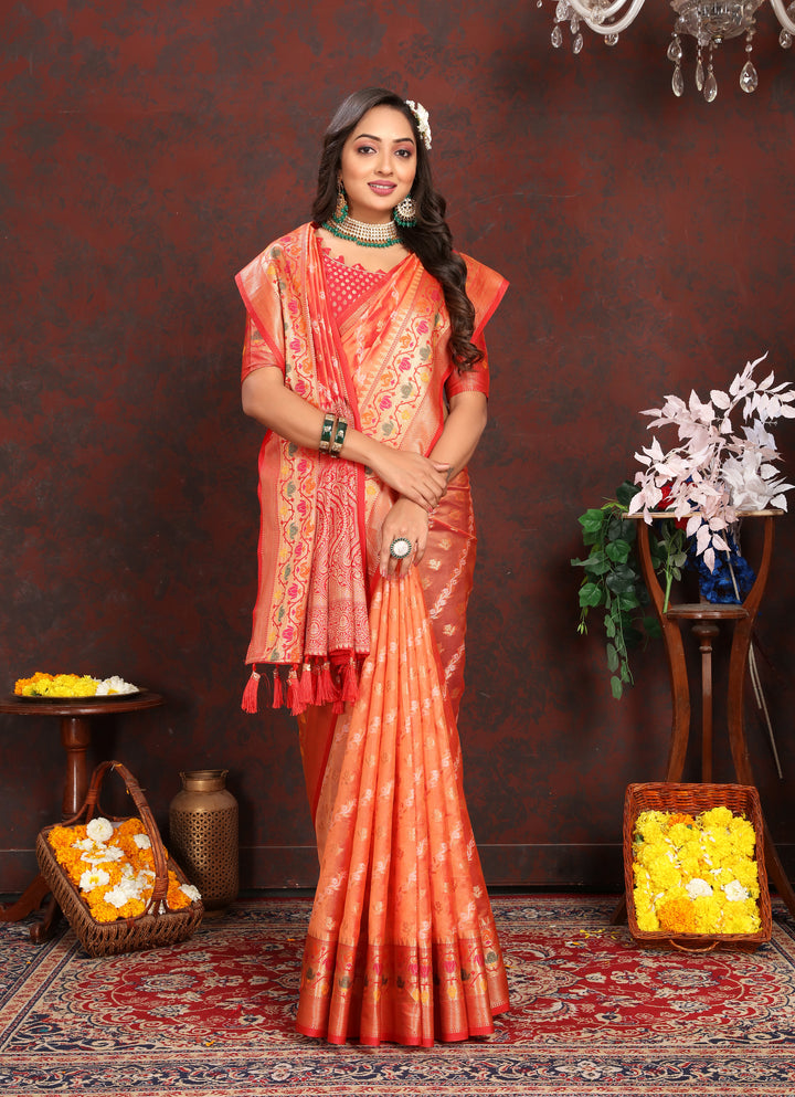 Timeless orange saree in soft organza featuring delicate embroidery and matching blouse piece, perfect for weddings.