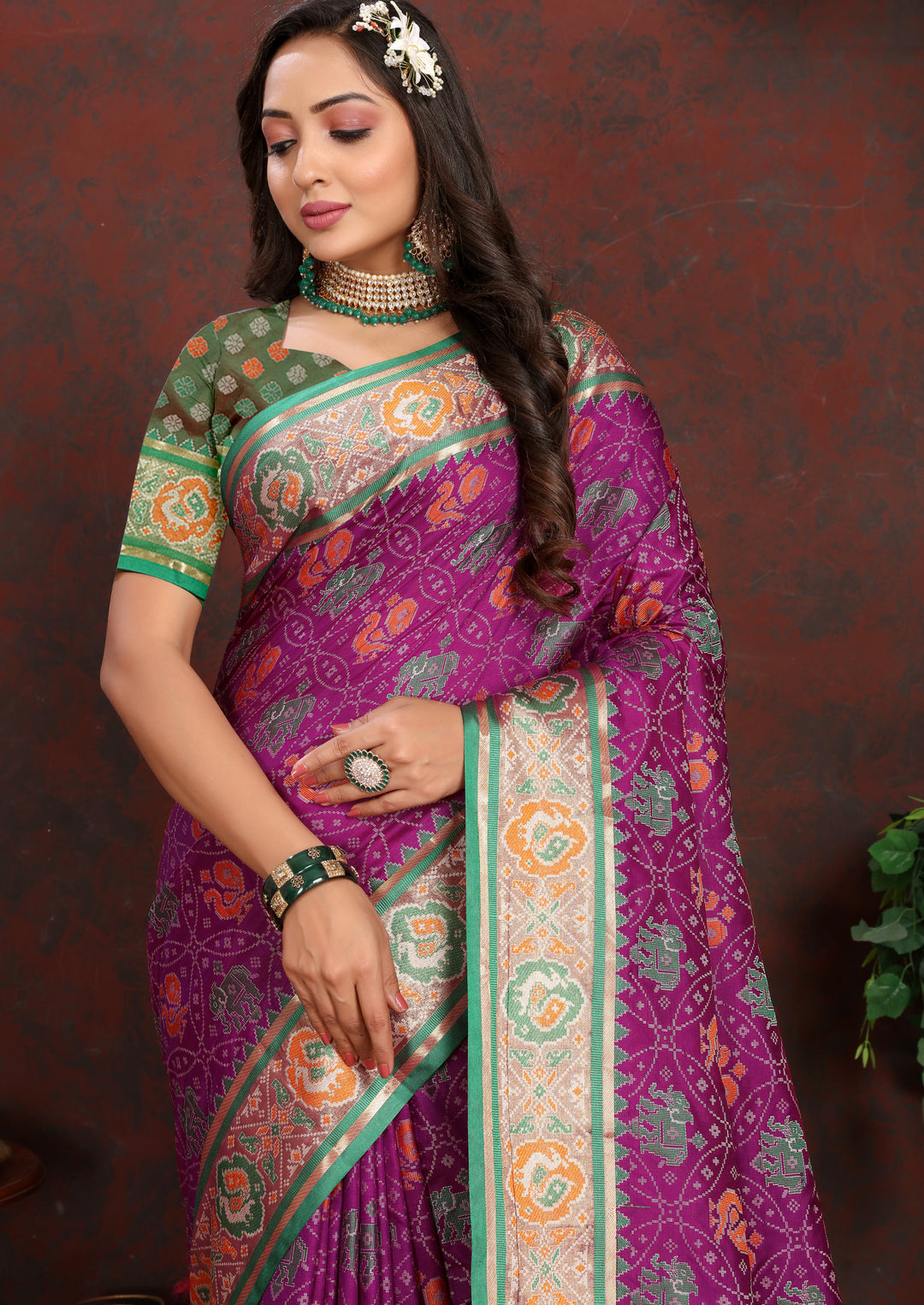 Stunning Purple Patola Silk Saree with dazzling meenakari motifs and a designer blouse for weddings.