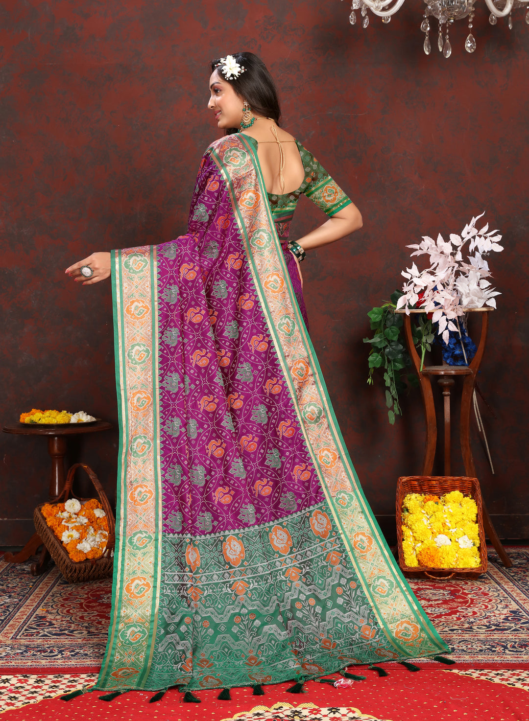 Elegant Purple Patola Silk Saree with rich meenakari motifs and a luxurious designer blouse for traditional events.