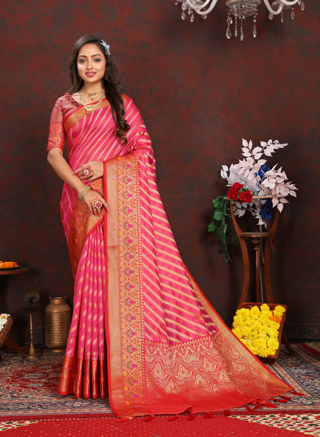 Elegant Coral-Pink Organza Saadi with traditional patterns and luxurious work for festive occasions.