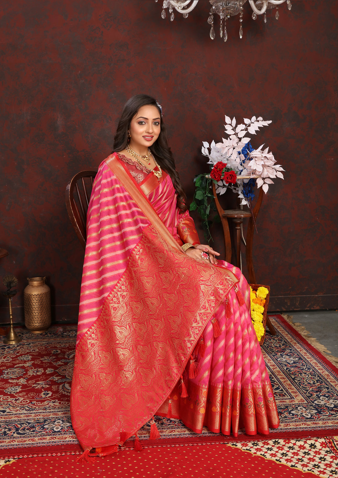 Radiant Coral-Pink Organza Saadi with finely woven designs and traditional luxury style.