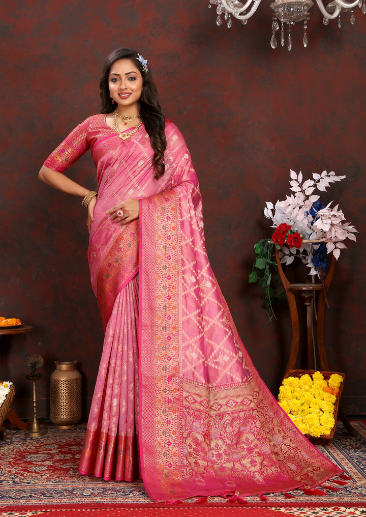 Elegant pink Organza sari featuring rich embroidery and matching blouse piece, ideal for grand events.