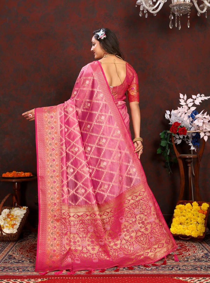 Sophisticated pink Organza silk sari with rich detail and matching blouse, perfect for festive celebrations.