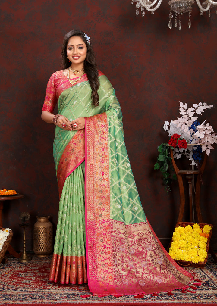 Green Designer Organza silk sari with intricate detail, perfect for cultural Indian events.