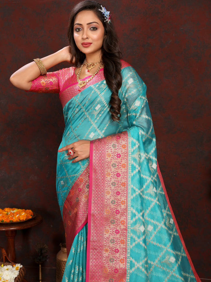 Elegant sky blue Organza sari with intricate embroidery and matching blouse piece, ideal for special occasions.