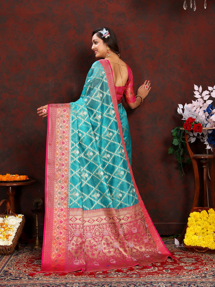 Beautiful sky blue Organza sari with luxurious detailing, ideal for traditional Indian gatherings.