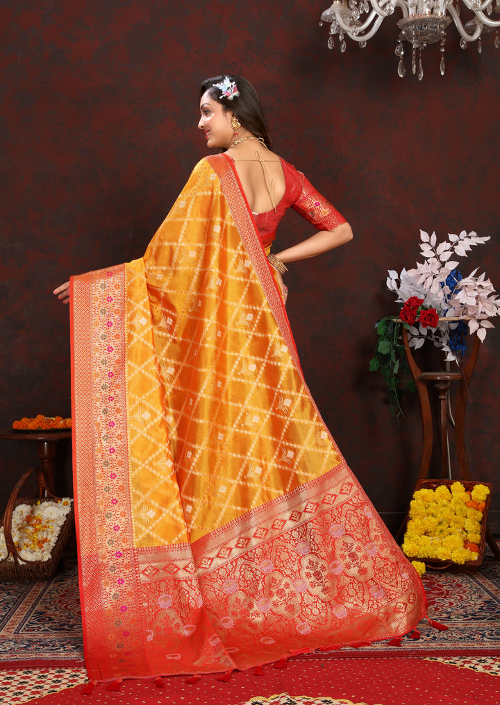 Yellow Organza silk sari with beautiful detailing, perfect for festive Indian gatherings.