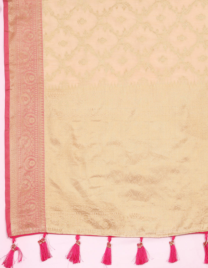 Stunning beige Katan silk saree with intricate golden zari weaving, perfect for elegant gatherings.