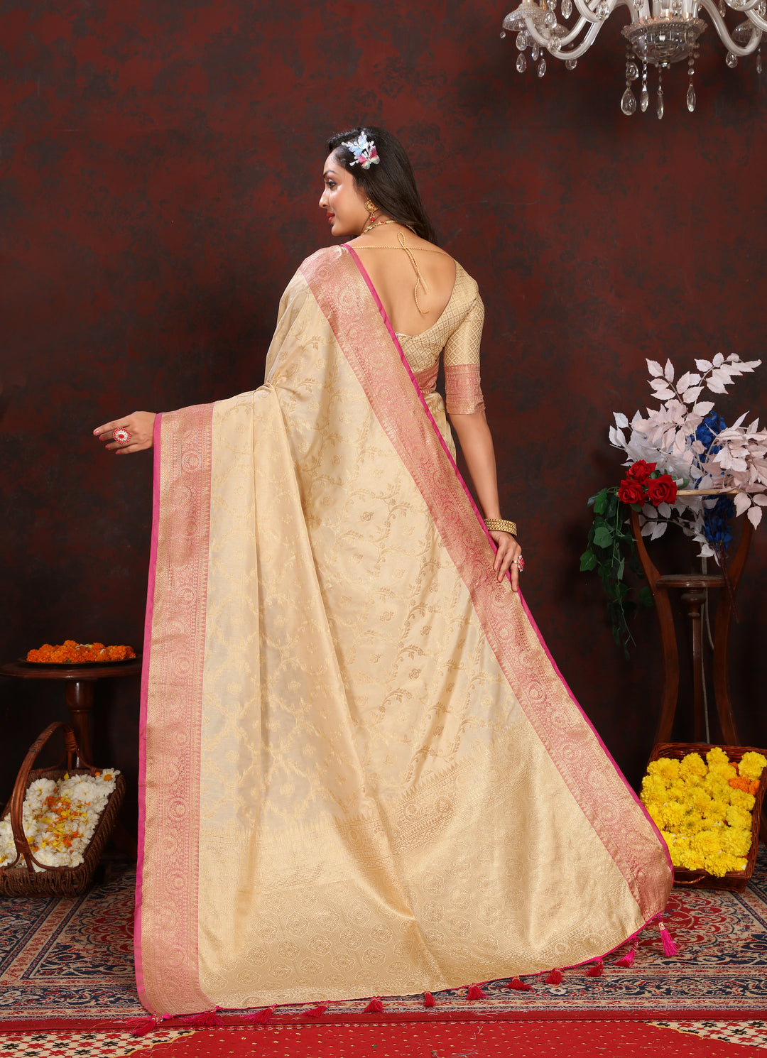 Graceful beige Katan silk saree with detailed zari weaving and matching blouse piece for festive occasions.