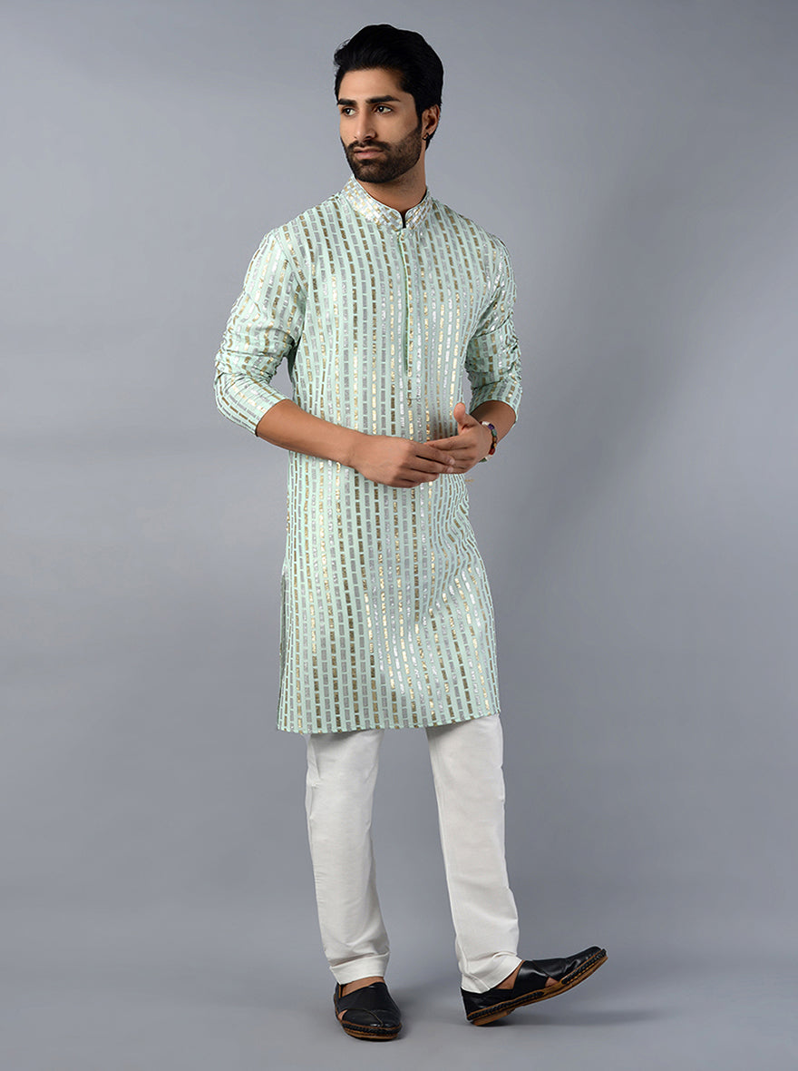 Celebrate in style with our beautifully crafted pista green kurta set, ideal for modern festivities.