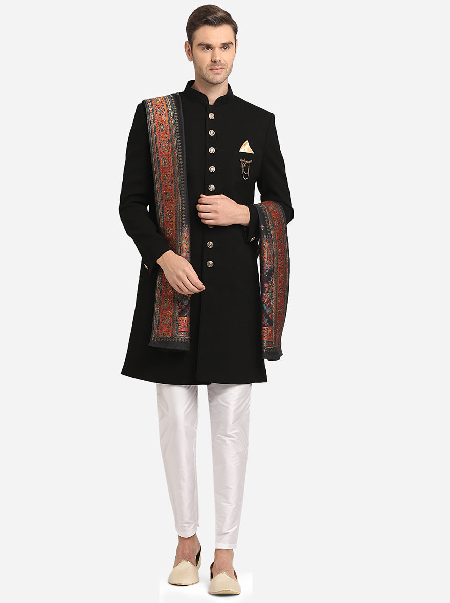 Black Indo Western outfit for men, featuring a stylish ethnic coat and slim pyjama for weddings.