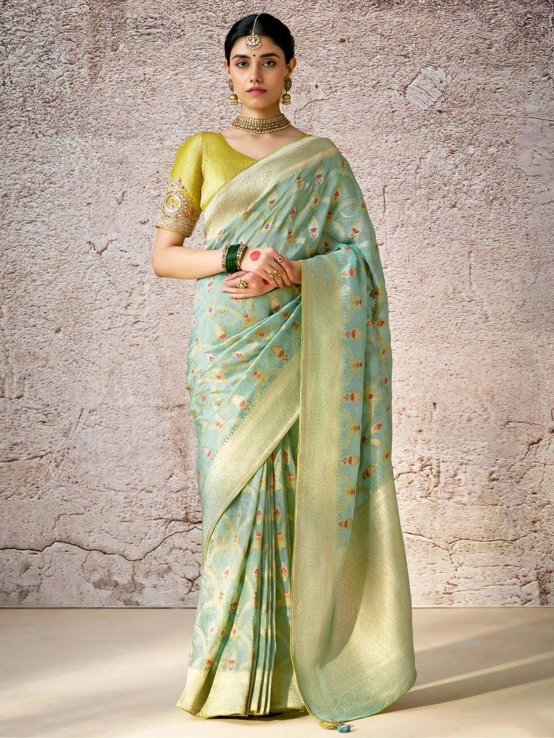 Green silk saree crafted for elegance and style.