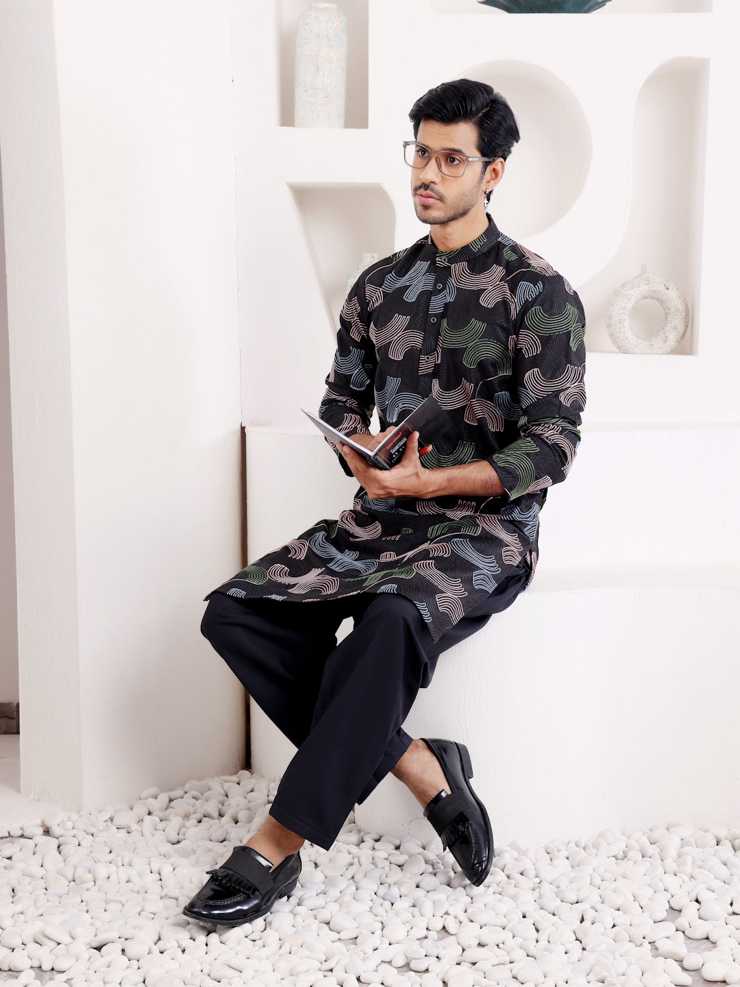 Opulent men's kurta featuring handwoven embroidery for traditional wear.