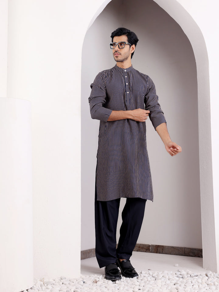 Men's navy blue festive kurta pajama set with intricate designs
