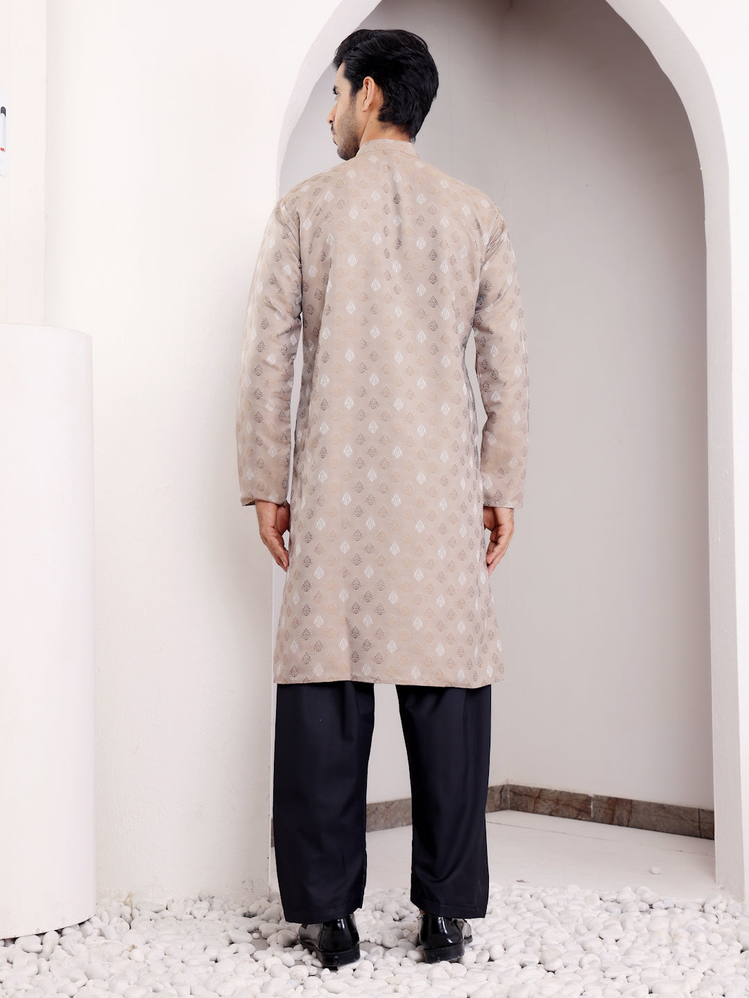 Light brown kurta with delicate handwoven details on the neckline and sleeves, offering a sophisticated appeal.