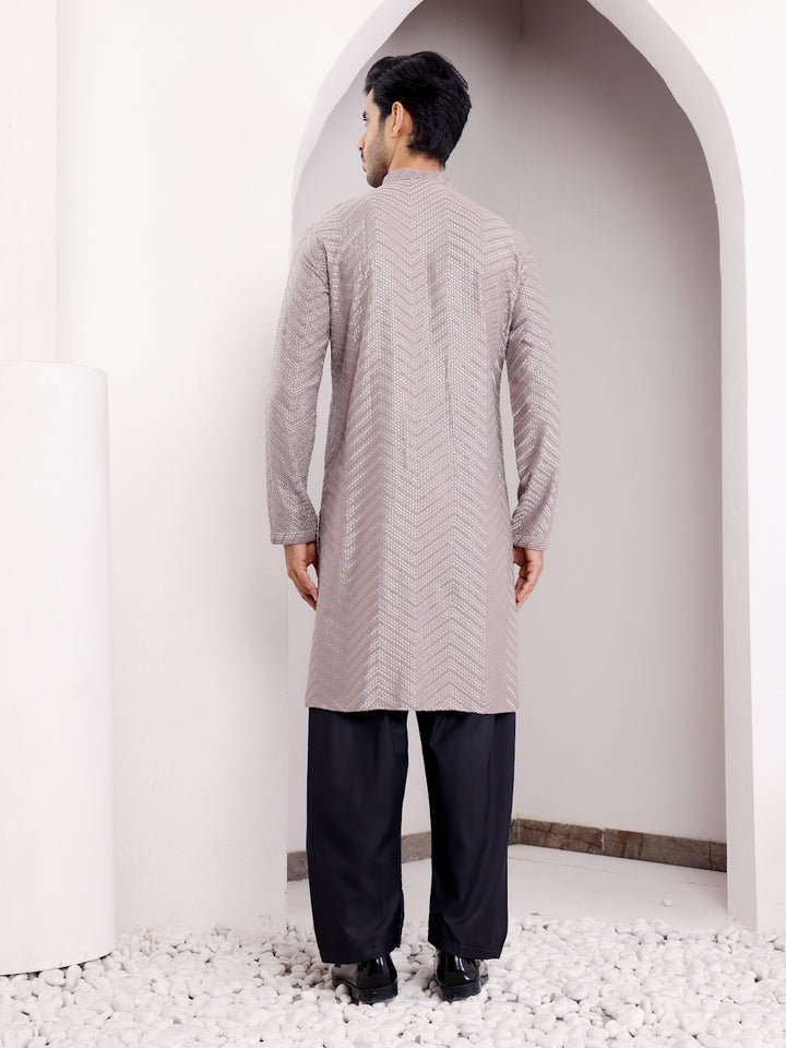 Elegant dark grey Viscose kurta set featuring intricate handwoven motifs and Chikankari detailing.