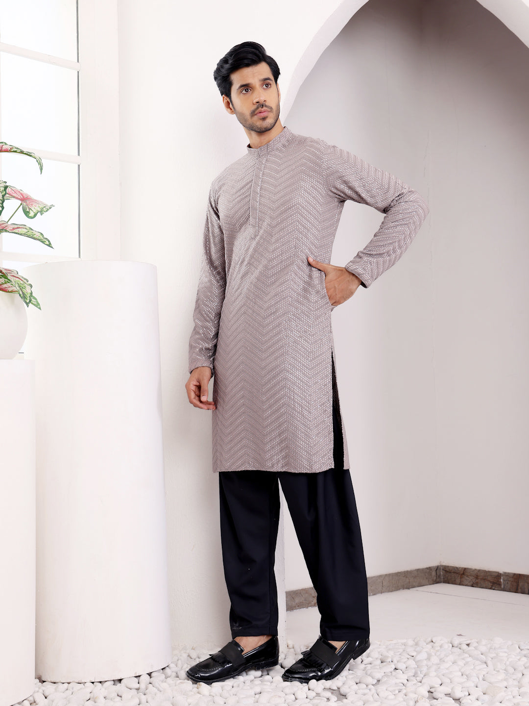 Dark grey kurta set for men featuring intricate embroidery and handwoven motifs, perfect for formal events.