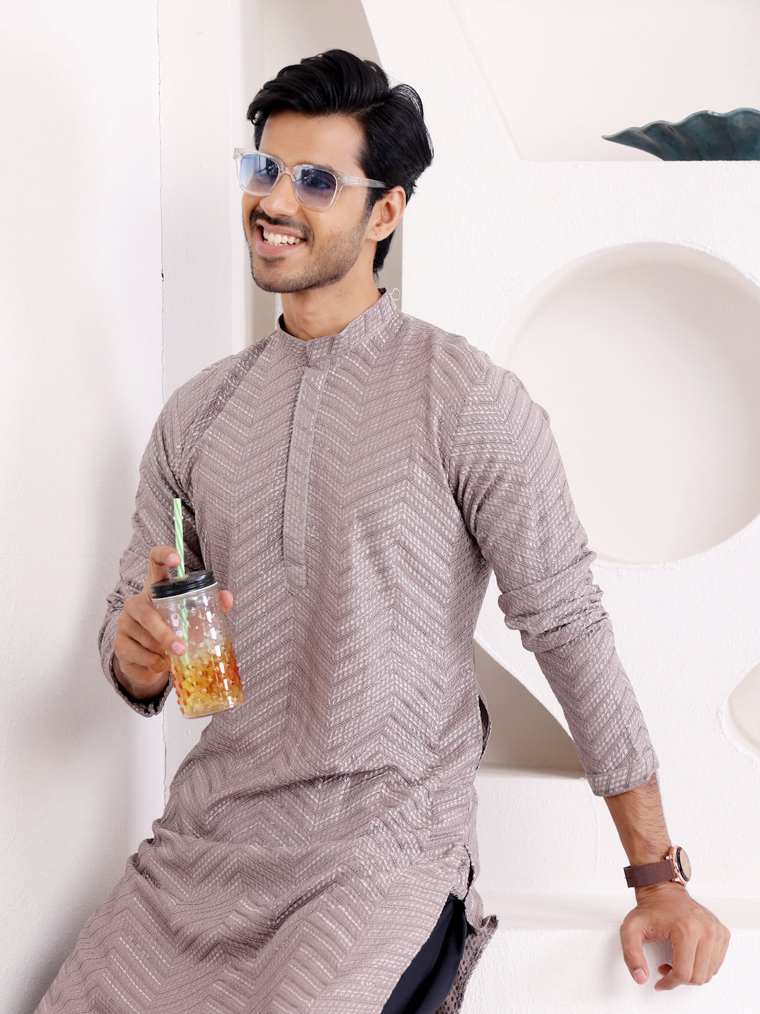 Handcrafted dark grey kurta set for men, with intricate Chikankari embroidery and handwoven motifs.