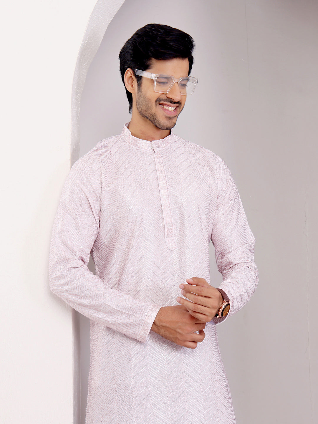 Handcrafted light pink kurta set featuring delicate Chikankari work and handwoven detailing.