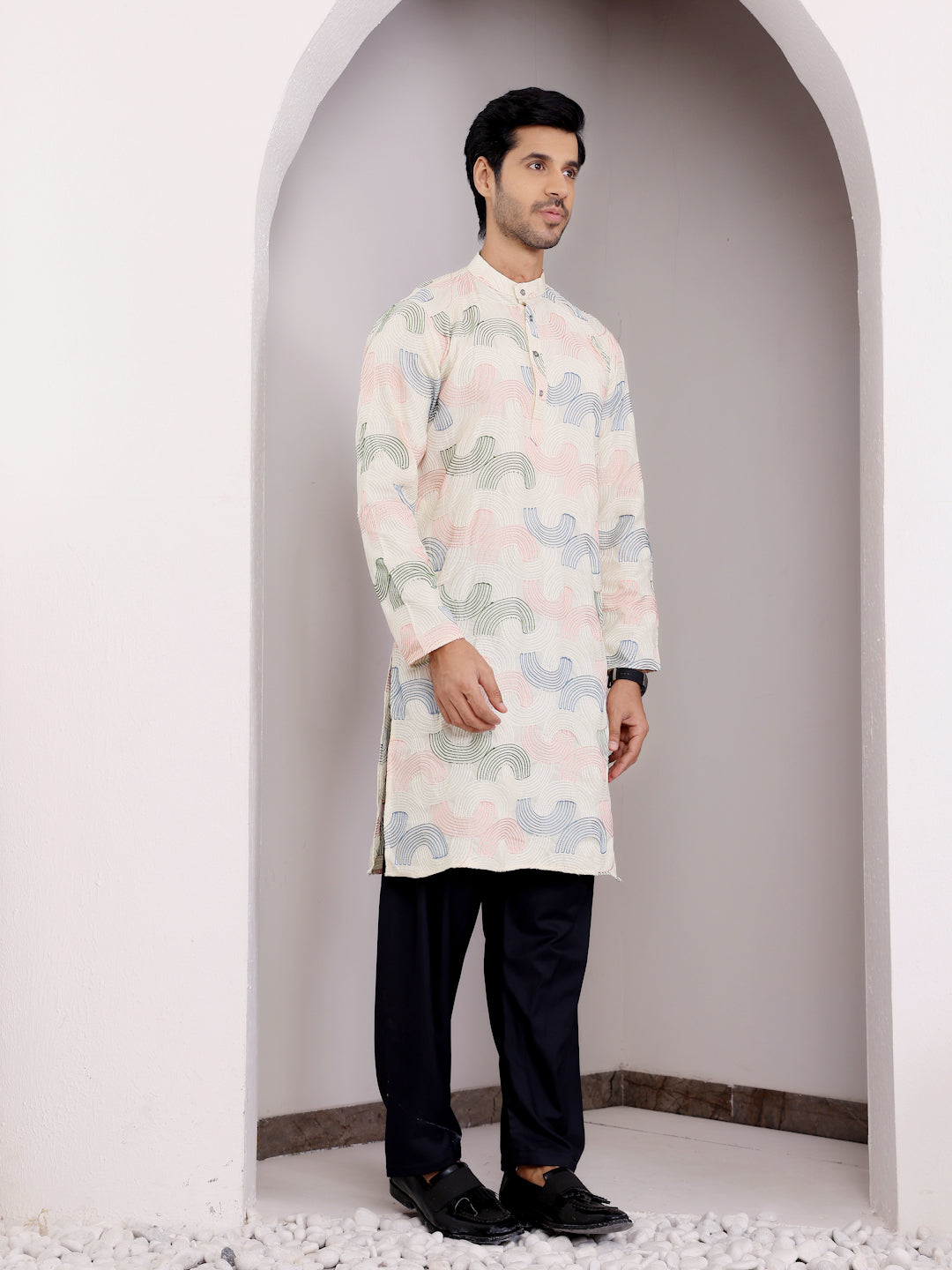 Premium linen kurta with intricate embroidery and full sleeves for men.