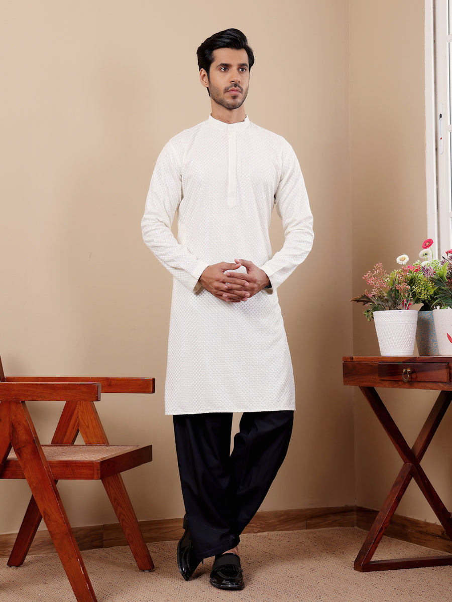 Traditional white kurta for men with Chikankari embroidery and handwoven detailing across the chest and sleeves.