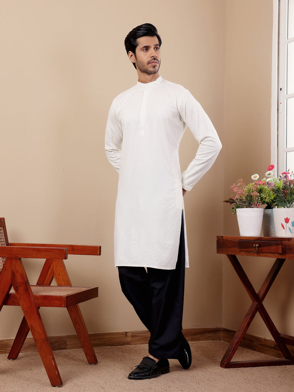 Elegant white Viscose kurta set featuring handwoven motifs and embroidered Chikankari work.