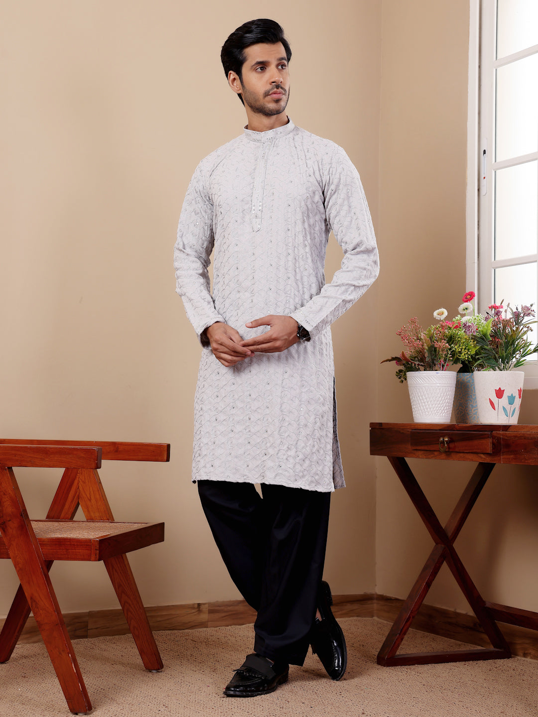 Premium men's ethnic kurta crafted from cotton with intricate weaved details for sophisticated style.