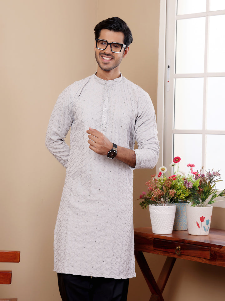 Sophisticated men's kurta for festivals, made from premium cotton and detailed weaving.