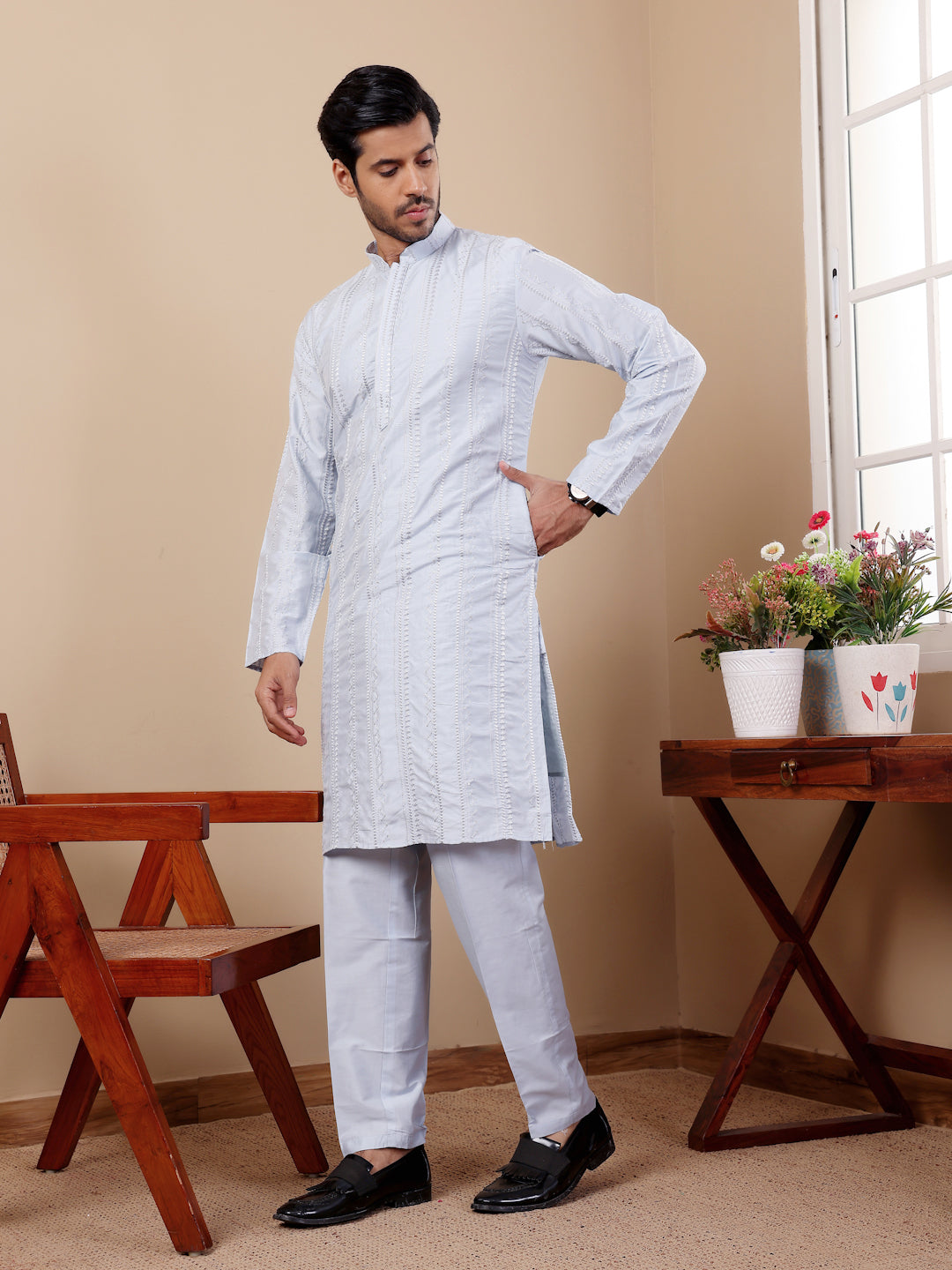 Stylish light blue cotton kurta with delicate motifs for a timeless look.