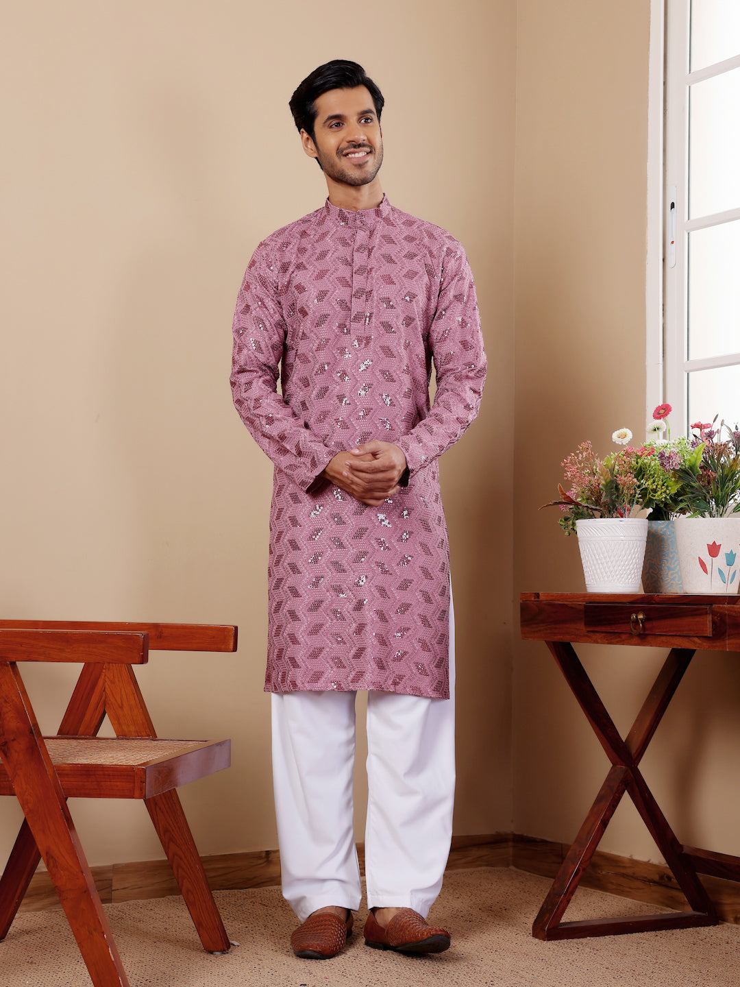 Pinkish purple kurta pajama for men with Chikankari embroidery for weddings and events.