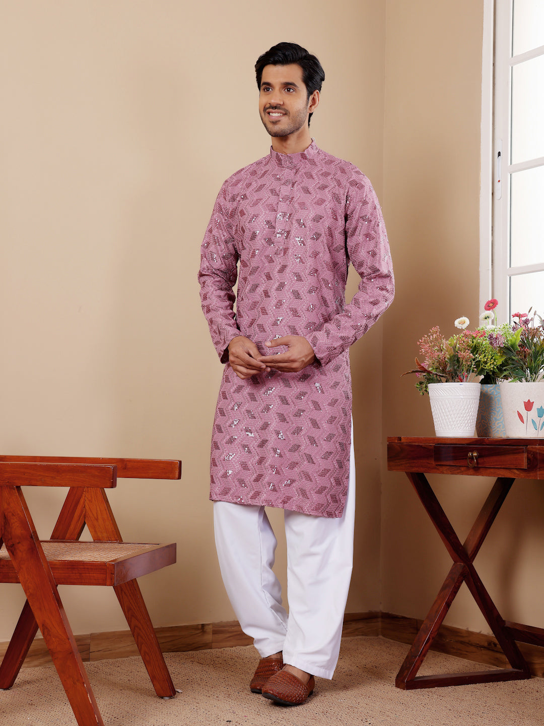 Men's pinkish purple kurta set featuring fine Chikankari work and art silk bottoms.