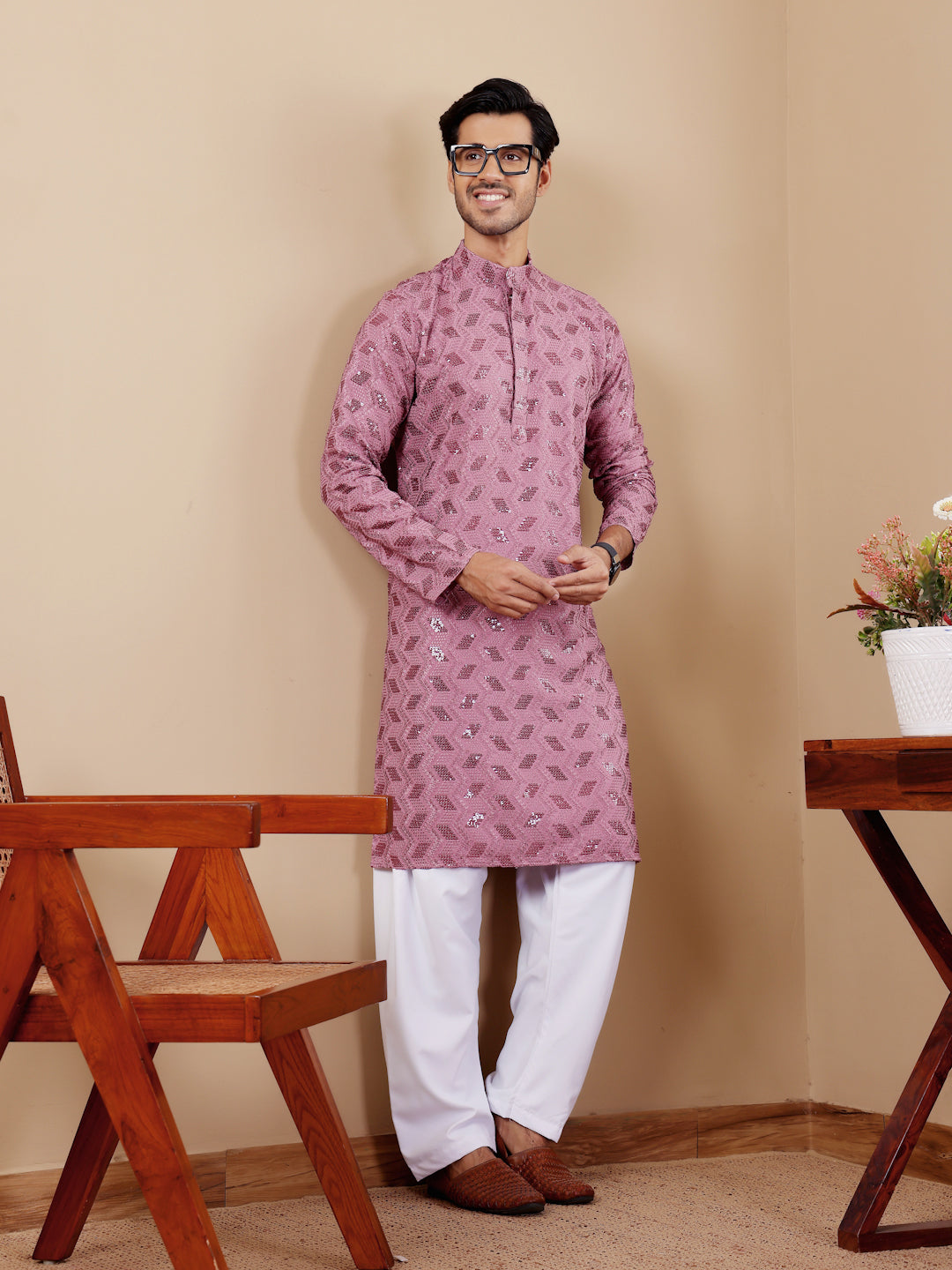 Elegant Chikankari kurta for men in pinkish purple for engagement ceremonies.