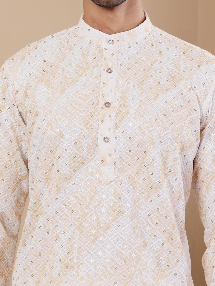 Modern yellow kurta pajama for men showcasing intricate chikankari and floral designs.