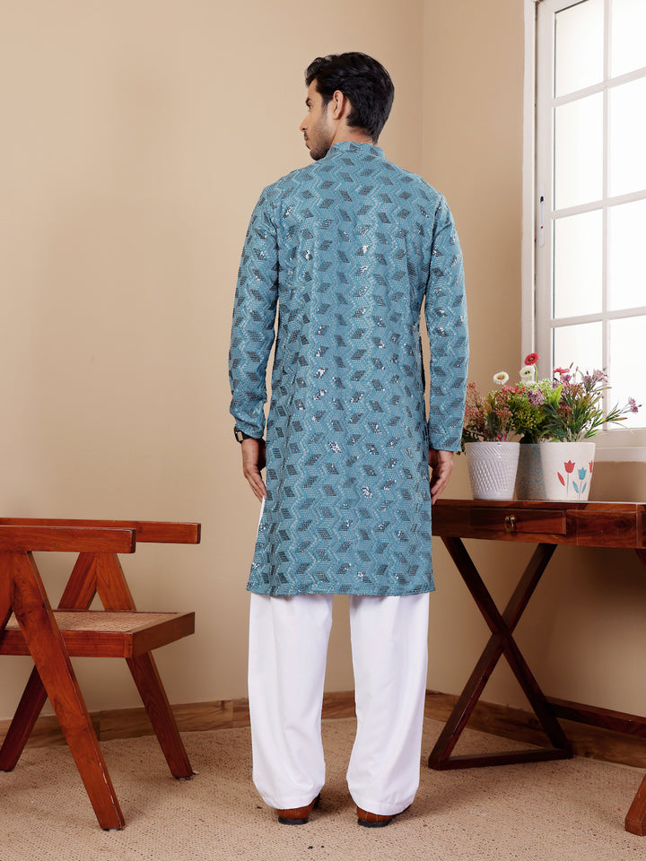 Cyan blue kurta pajama with Chikankari embroidery for festive events.