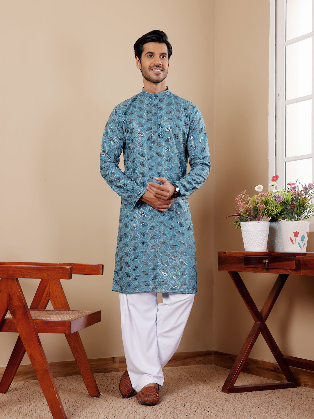 Cyan blue kurta pajama for men featuring fine Chikankari embroidery and art silk bottoms.