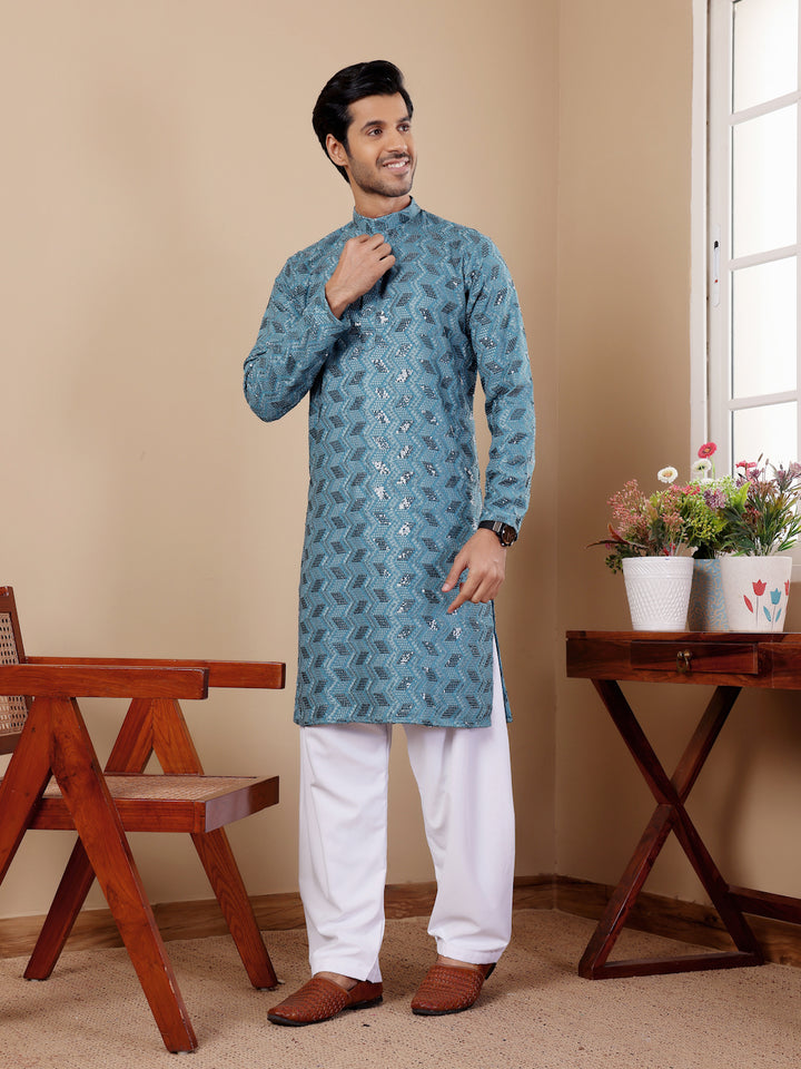 Elegant cyan blue kurta for men with intricate Chikankari work and art silk bottoms.