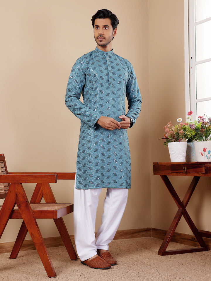 Men's Chikankari kurta pajama in cyan blue, ideal for weddings and cultural events.