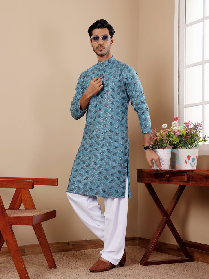 Men's wedding kurta in cyan blue with Chikankari work and soft art silk.