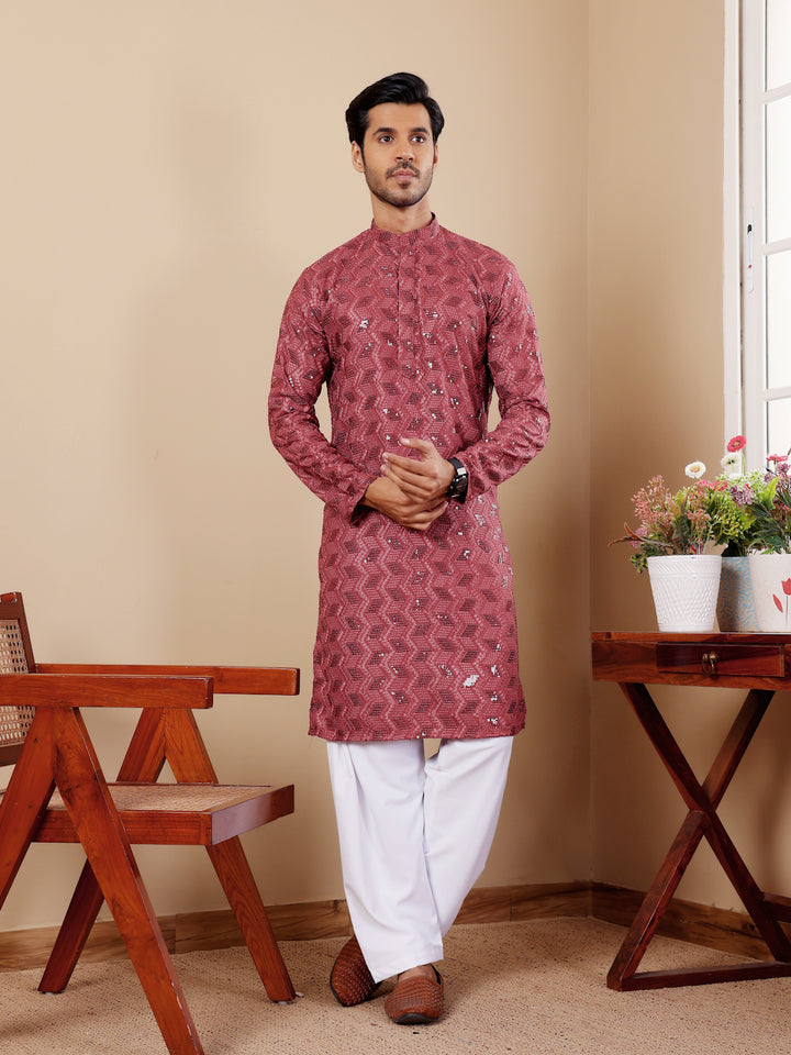 Elegant barry red kurta with Chikankari embroidery and soft art silk bottoms.