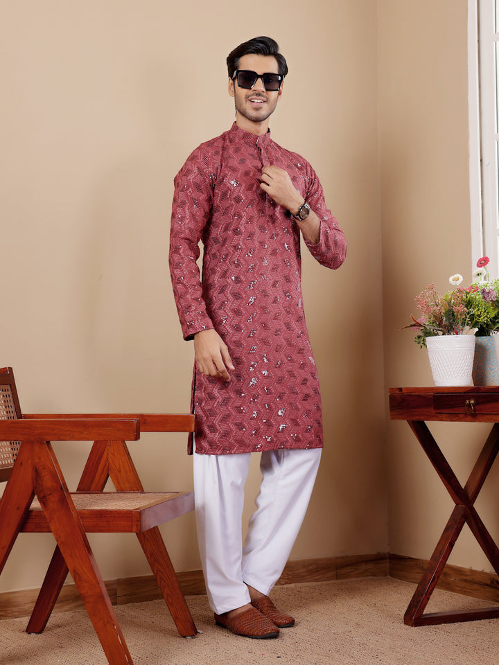 Traditional barry red kurta with delicate Chikankari work and art silk bottoms for men.