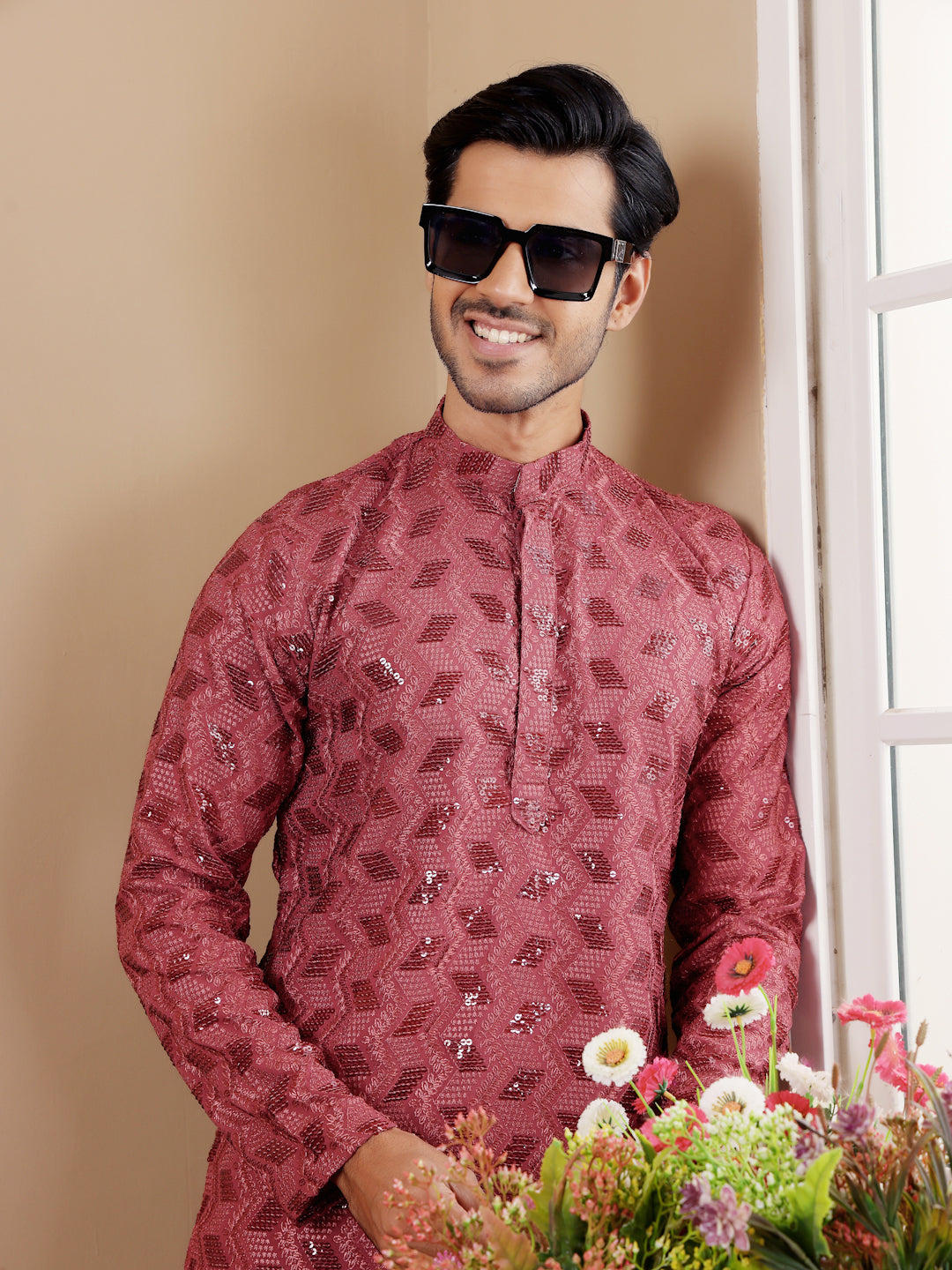 Stylish barry red kurta with intricate Chikankari detailing and art silk bottoms.