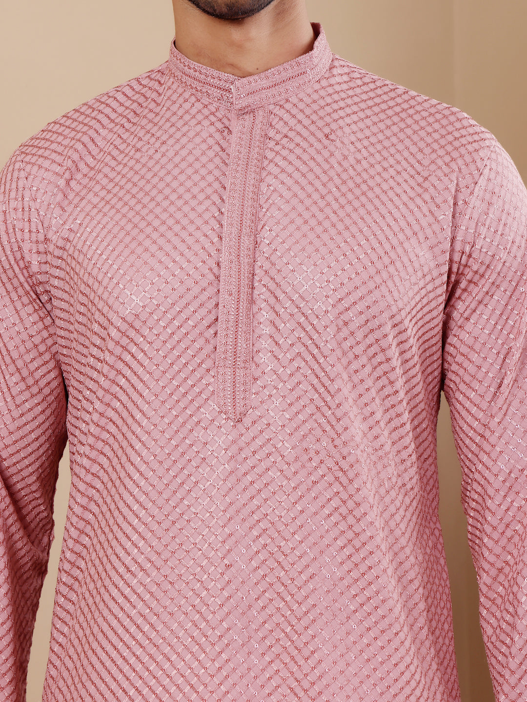 Sophisticated onion pink kurta for men with intricate Chikankari work and comfortable art silk bottoms.