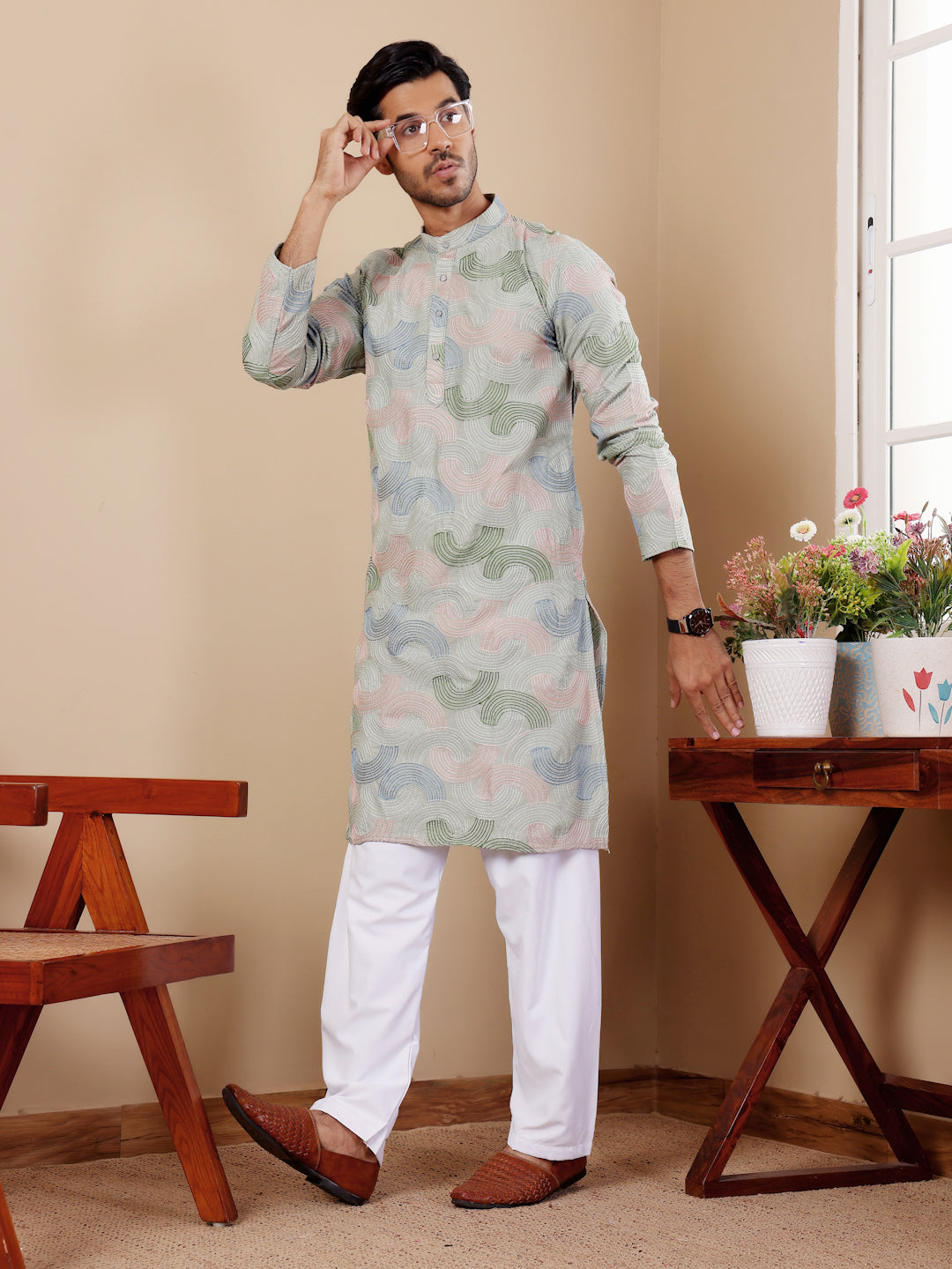 Elegant men's kurta set with art silk bottom and handwoven motifs.