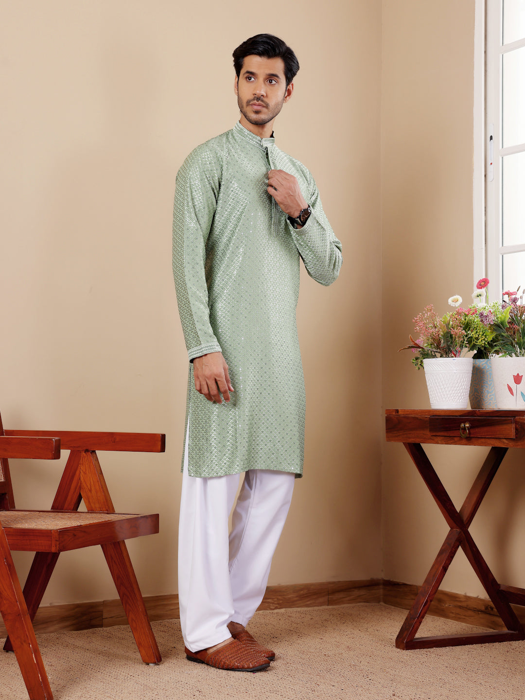 Men’s pastel green kurta featuring Chikankari embroidery and breathable viscose fabric.