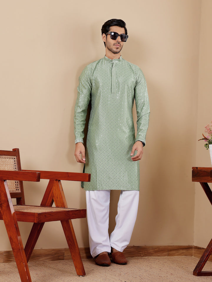 Stylish pastel green kurta set for men with delicate embroidery, ideal for family events.